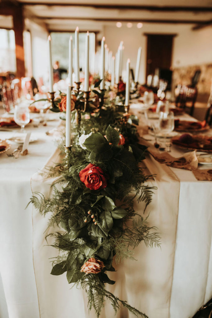Lush garland running down a family style table