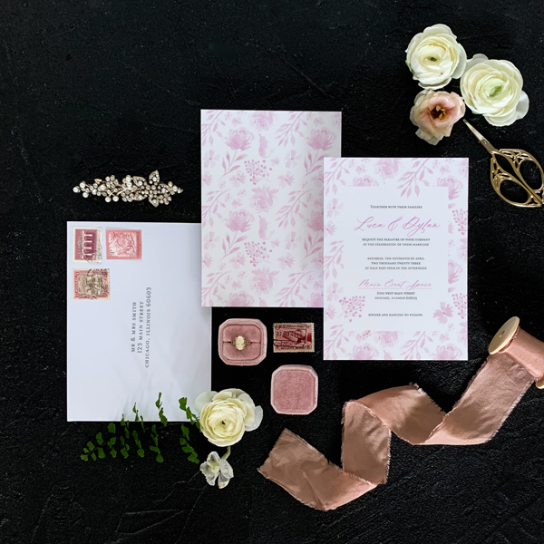 Blush wedding invitation with white envelope