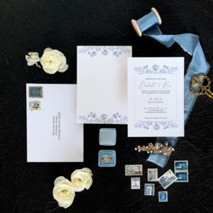 Blue wedding invitation flatlay