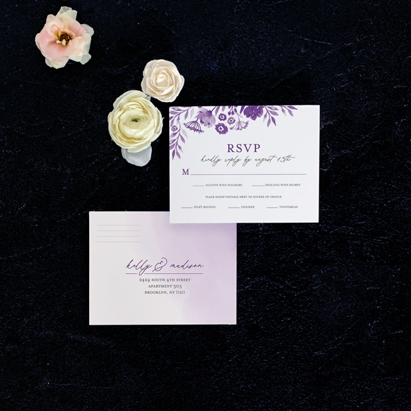 Daisy reply card flat lay in plum