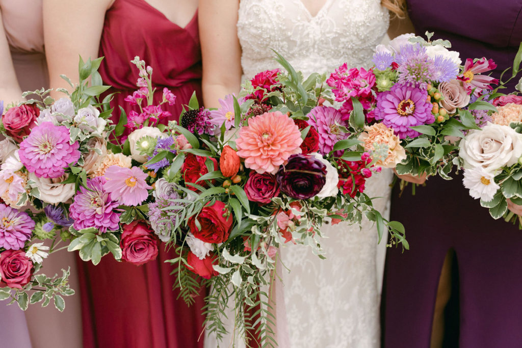 Close up of bridesmaid bouquets in a line
