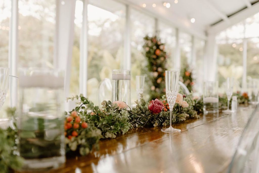 Guest Table set with floral garland and glassware