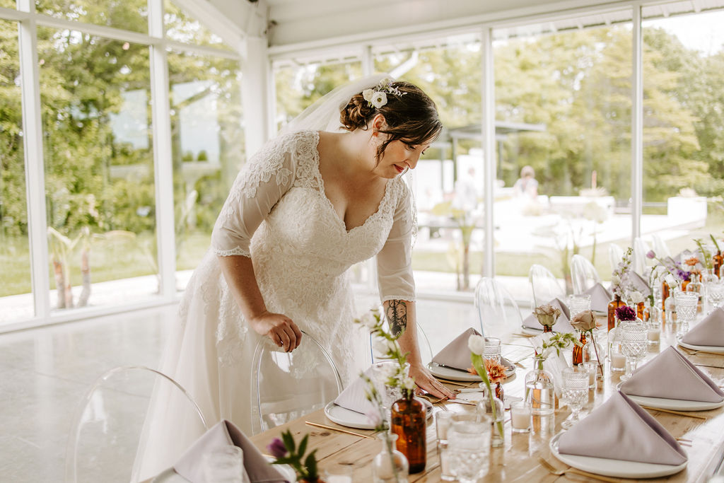 Bride looking at tablescape details