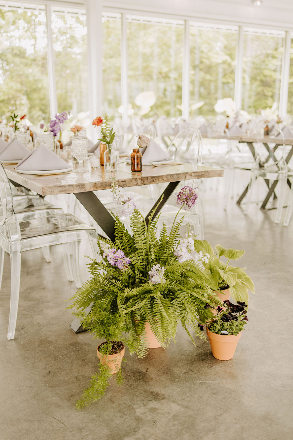 Potted plants at the base of the reception tables