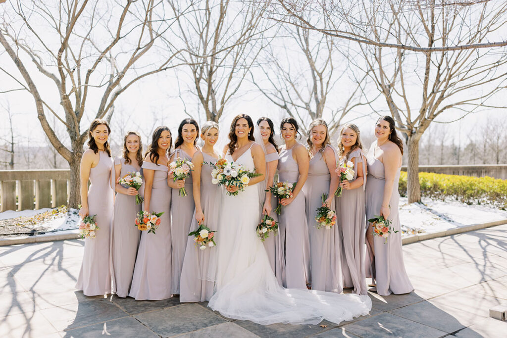 Bride and bridesmaid portrait standing outdoors