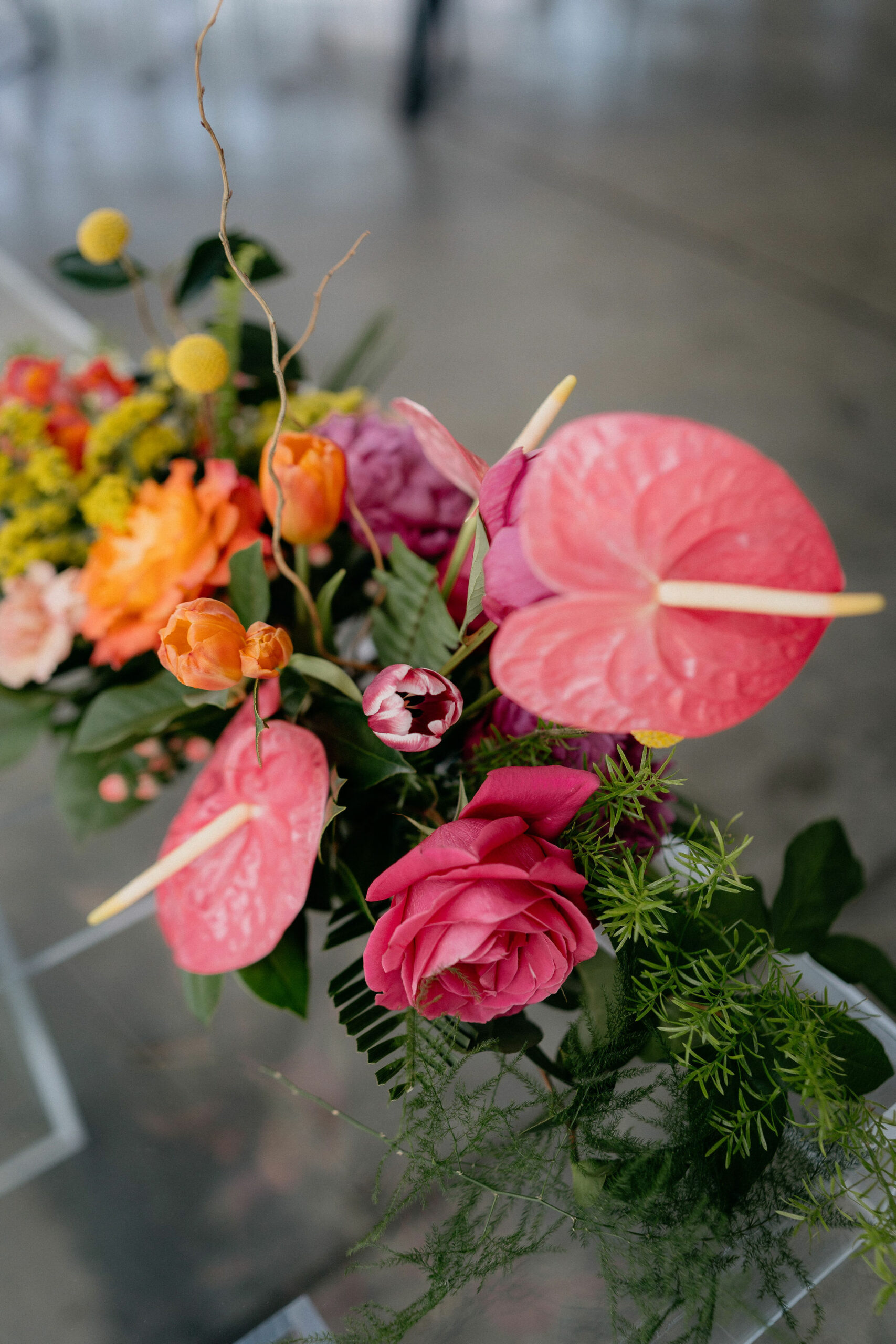 Sweetheart table arrangment with anthurium, tulips, and roses