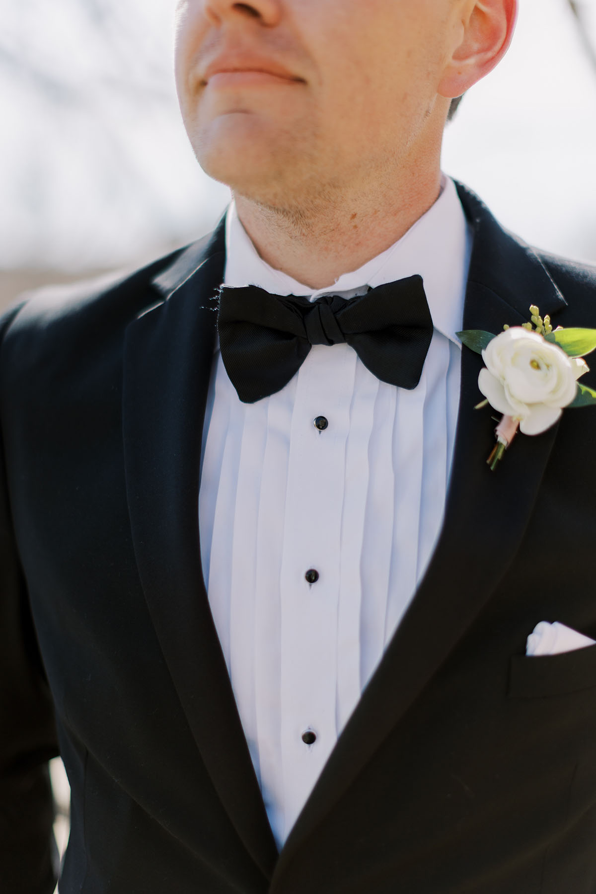 Close up of groom's boutonniere