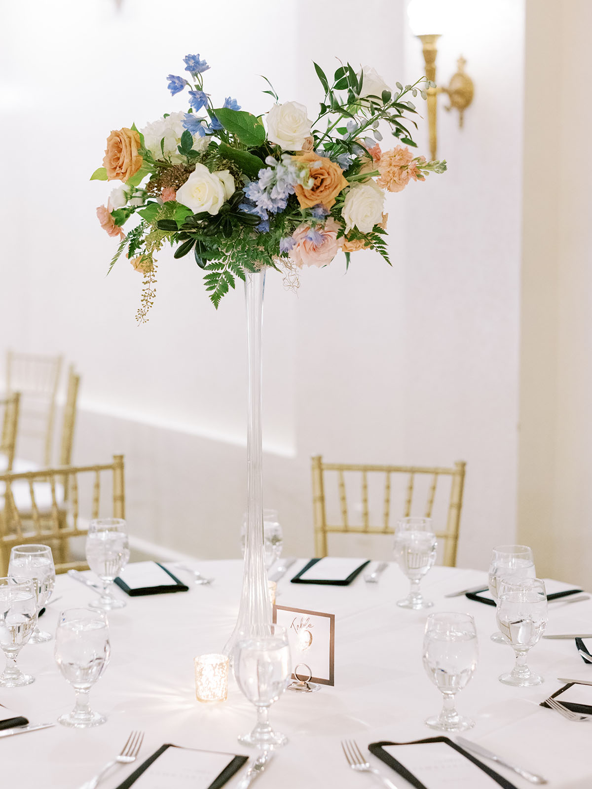 Tall floral centerpiece with Eiffel Tower vase