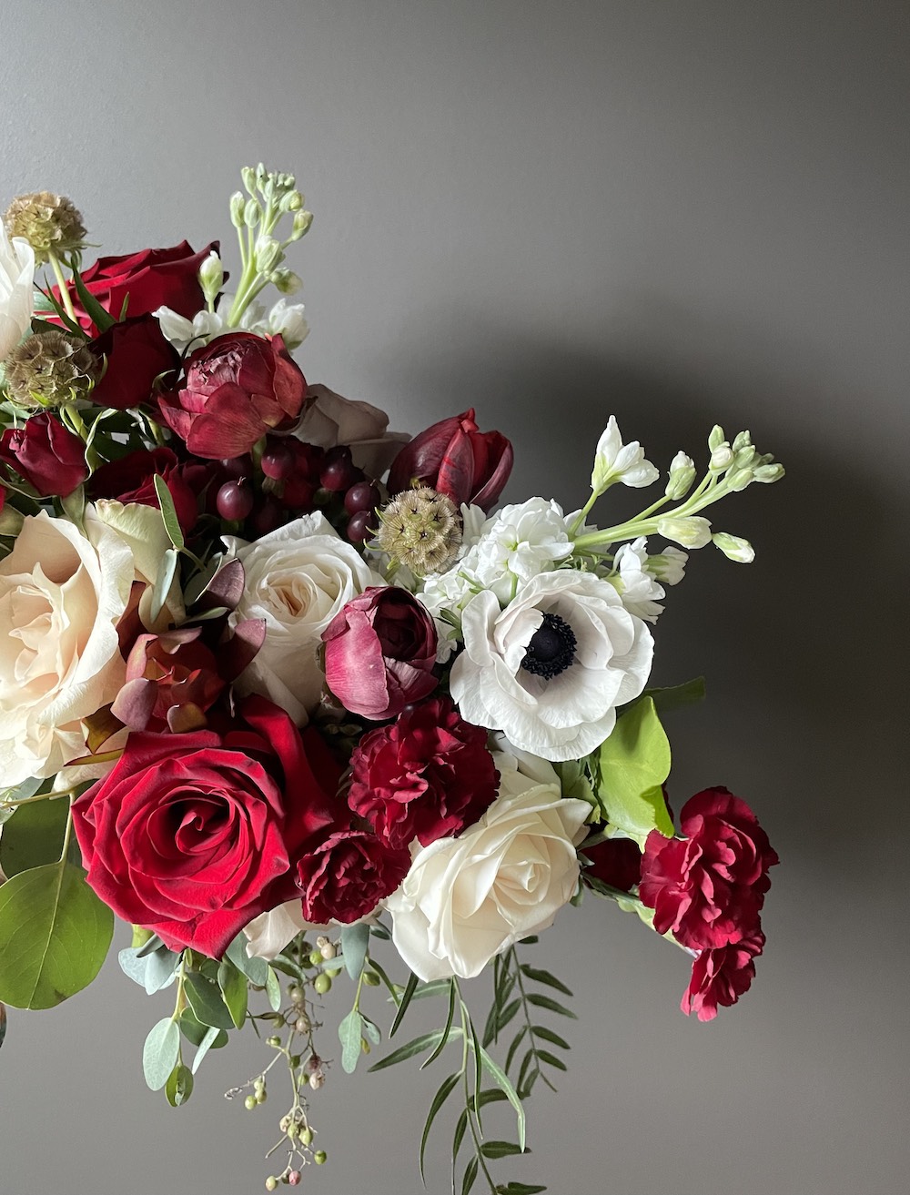 Moody Bouquet in whites, red, and deep burgundy