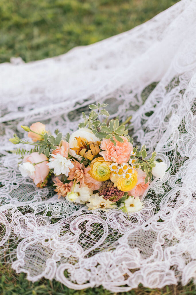 Bridal bouquet on lace veil
