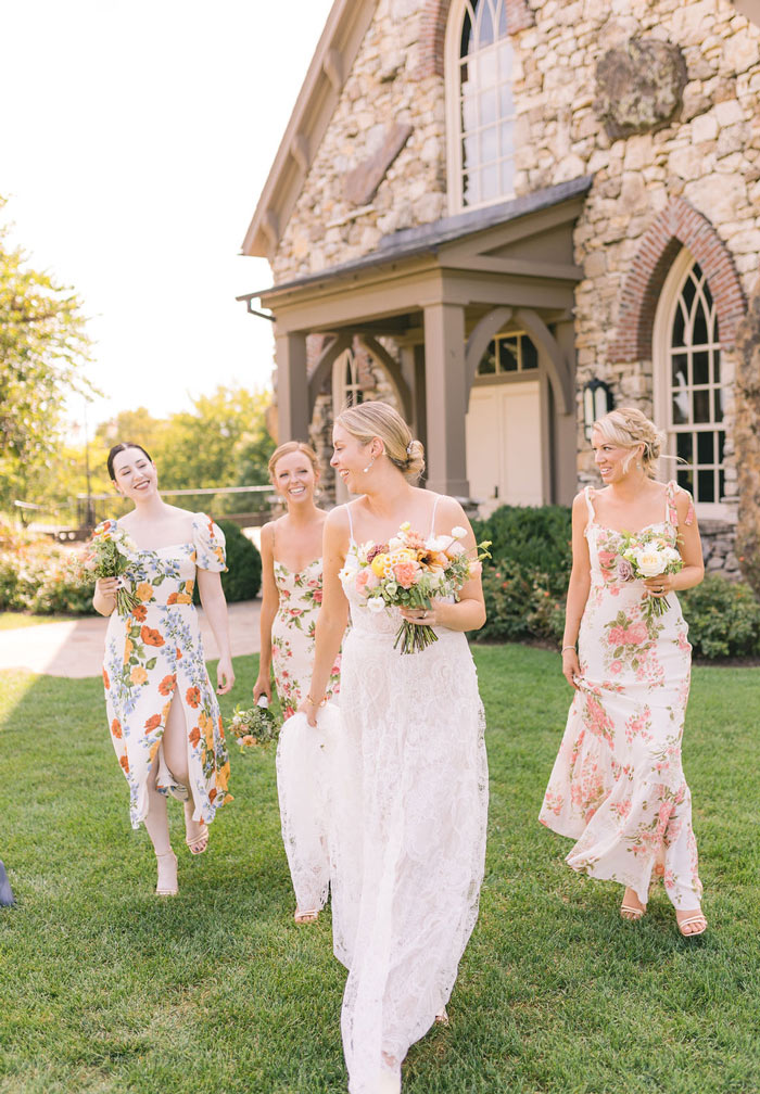 Bride walking with her three bridesmaids