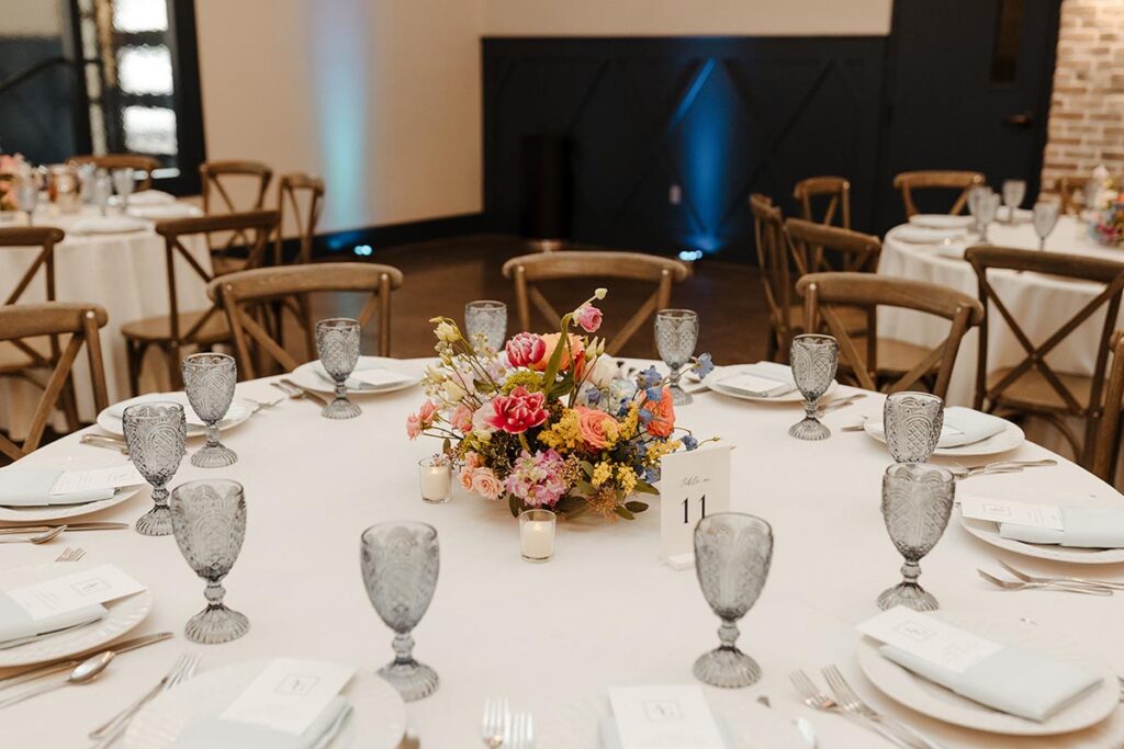 Guest table with vibrant floral arrangement