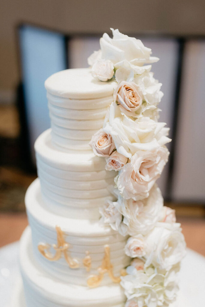 Detail shot of cake with cascading flowers by Tiers by Stephanie