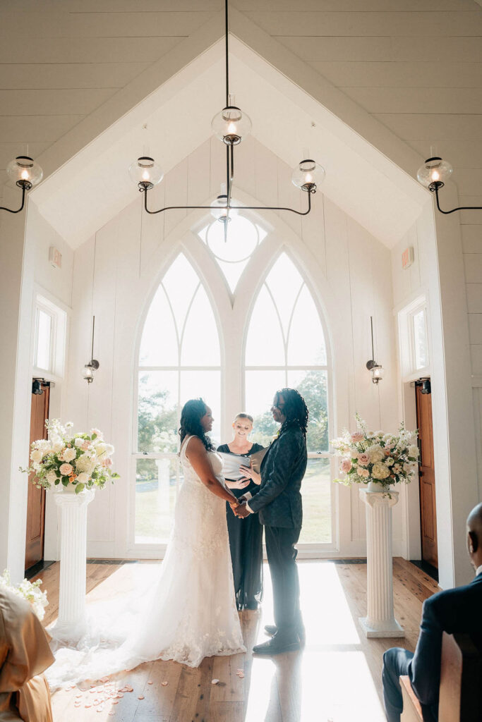 Bride and Groom holding hands during the ceremony